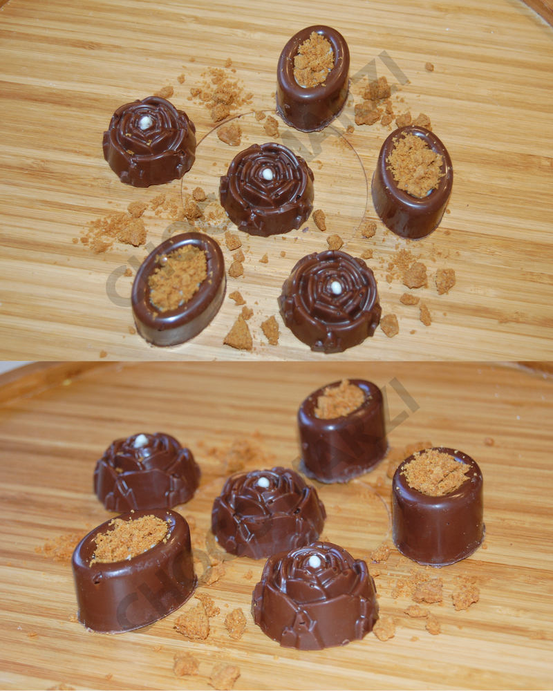 Six chocolate-covered confection pieces arranged on a light wood surface, with crumbs scattered around them. The top half shows three pieces standing upright and three lying on their side; the bottom half shows a closer view of the same pieces from a different angle.